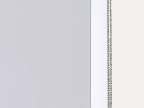 Close-up of a side channel holding the fabric edge, with the chain outside it