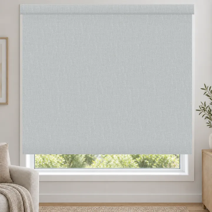 A roller blind with a fabric wrapped fascia across the top