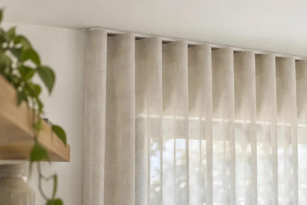 Close view of the S Fold heading on a sheer curtain hanging from a ceiling-fixed track